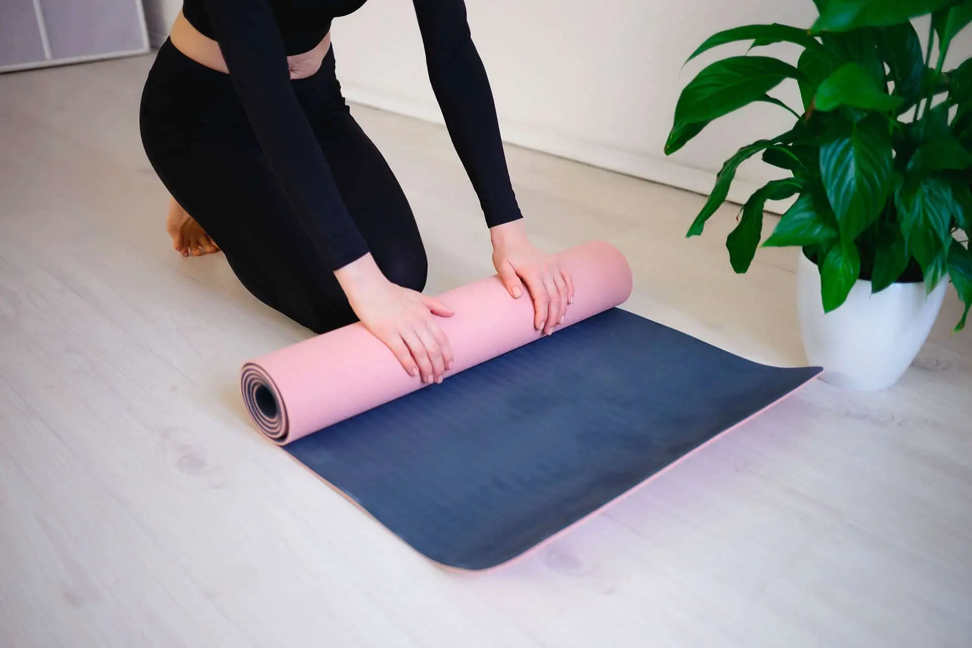 female hands unfold yoga mat preparing for practic 2021 09 01 19 47 51 utc